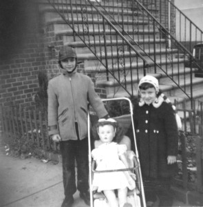 This picture was taken when I was 5 years old.  My Parents bought me a Patty Play Pal Doll and I was standing in front of my house in the Bronx with my big brother Fred.  I was getting ready to take Patty for a ride in her carriage.  Patty and I were inseparable then, and we still are!